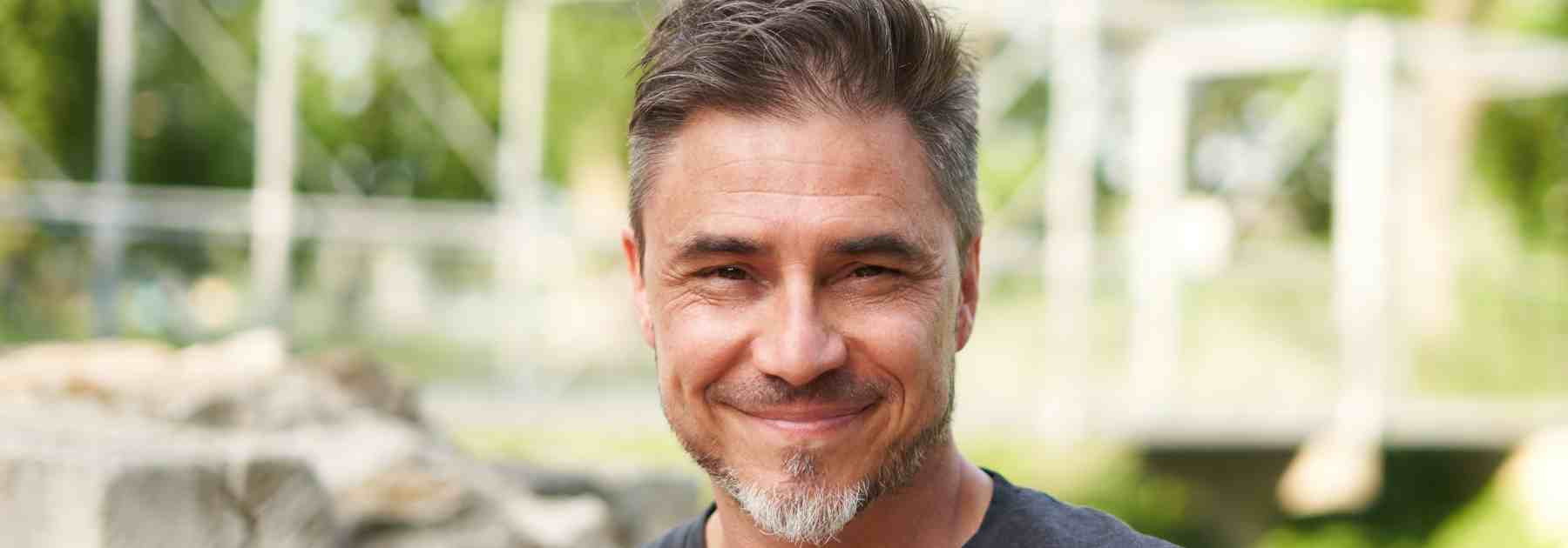 Happy man with hair loss treatment success 